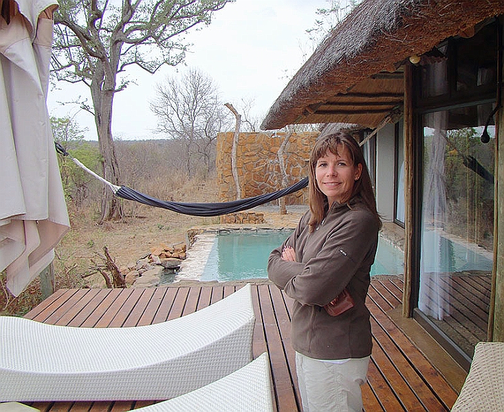 lhroom2.jpg - Tonya chills out on our deck.  The plunge pool and the outdoor shower are in the background